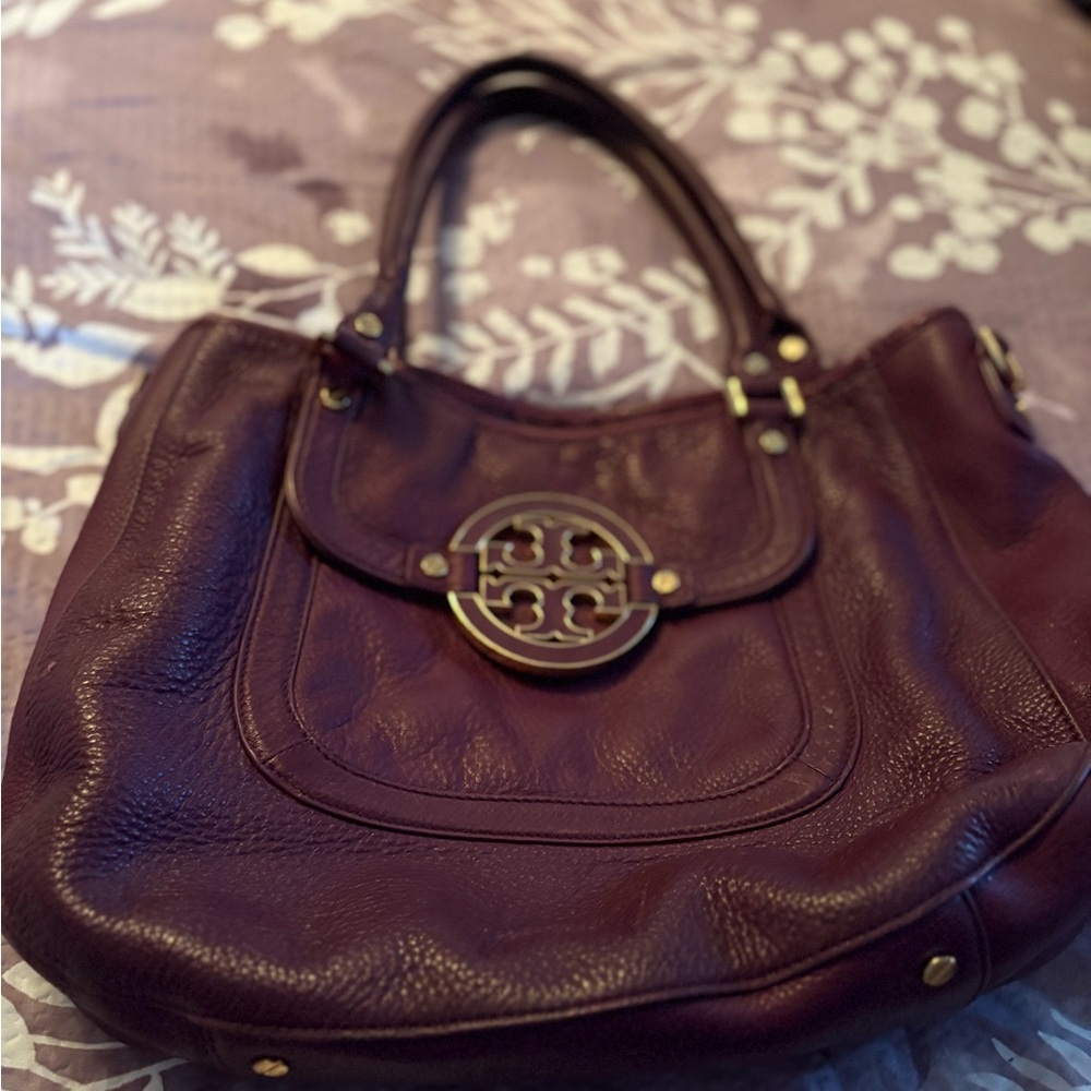 Tory Burch Amanda Handbag in a Pebbled Plum color